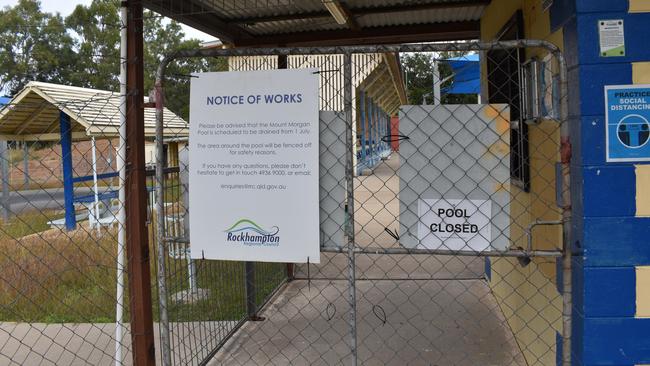 A notice on the pool's entrance stating the pool would be drained from July 1.