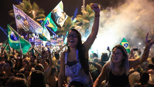 Supporters of Jair Bolsonaro celebrate in front of his house in Rio de Janeiro yesterday. Picture: Getty Images