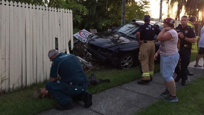 The 16-year-old boy being assessed by paramedics following the crash.