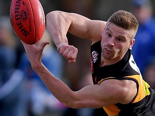 Dean Clare in action during the EDFL Tullamarine v Westmeadows football match in Tullamarine, Saturday, June 22, 2019. Picture: Andy Brownbill