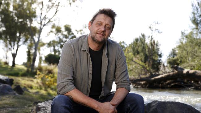 Golden Guitar Awards winner Shane Nicholson pictured at the Peel River in Tamworth. Picture: Jonathan Ng