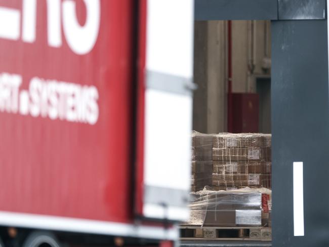 Trucks are loaded at a factory of US multinational pharmaceutical company Pfizer, in Puurs, where COVID vaccines are being produced for Britain. Picture: AFP