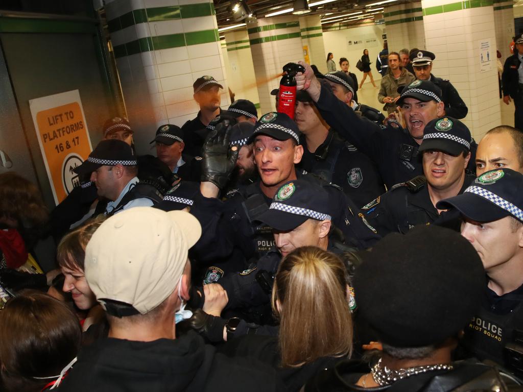 Police clash with protesters in Central Station. Picture: David Swift