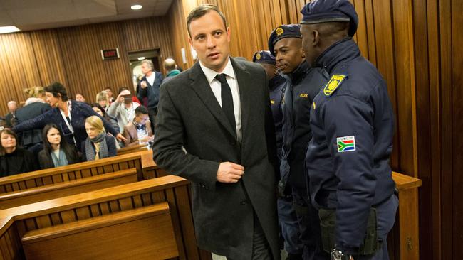Paralympian athlete Oscar Pistorius, accused of the murder of his girlfriend Reeva Steenkamp three years ago, arrives at the High Court in Pretoria. Picture: AFP
