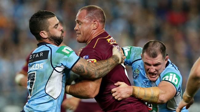 NSW's Adam Reynolds and Paul Gallen tackle Matt Scott. Picture: Gregg Porteous