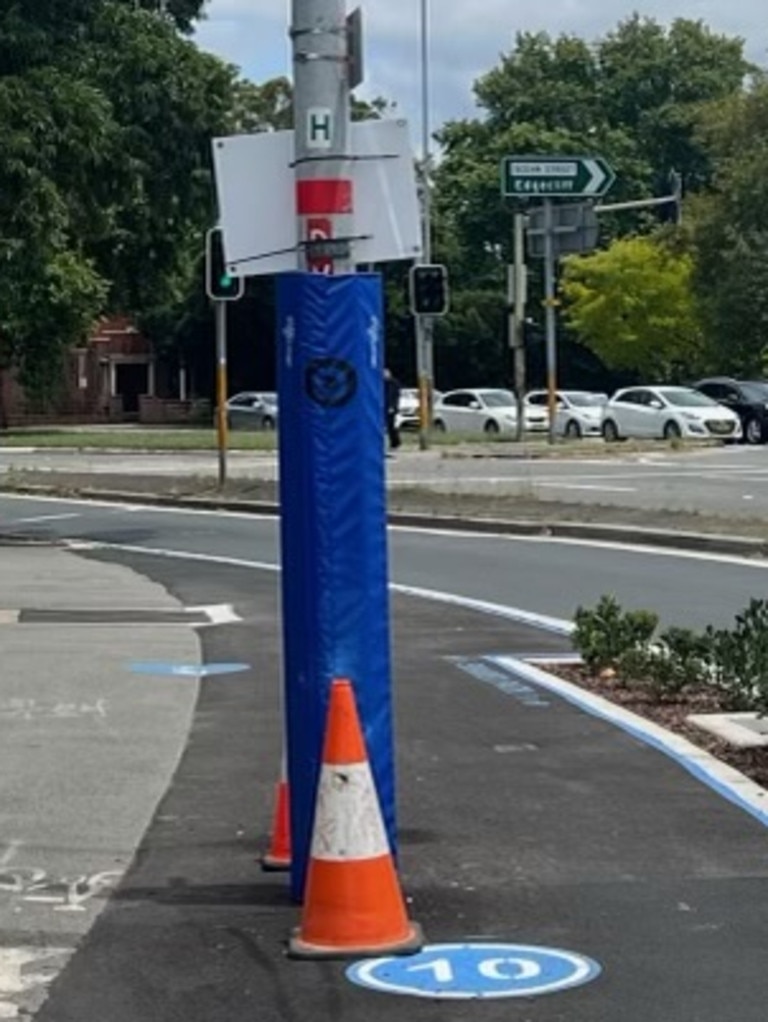 The hazard has been padded in blue plastic and flanked by traffic cones. Picture: Supplied.