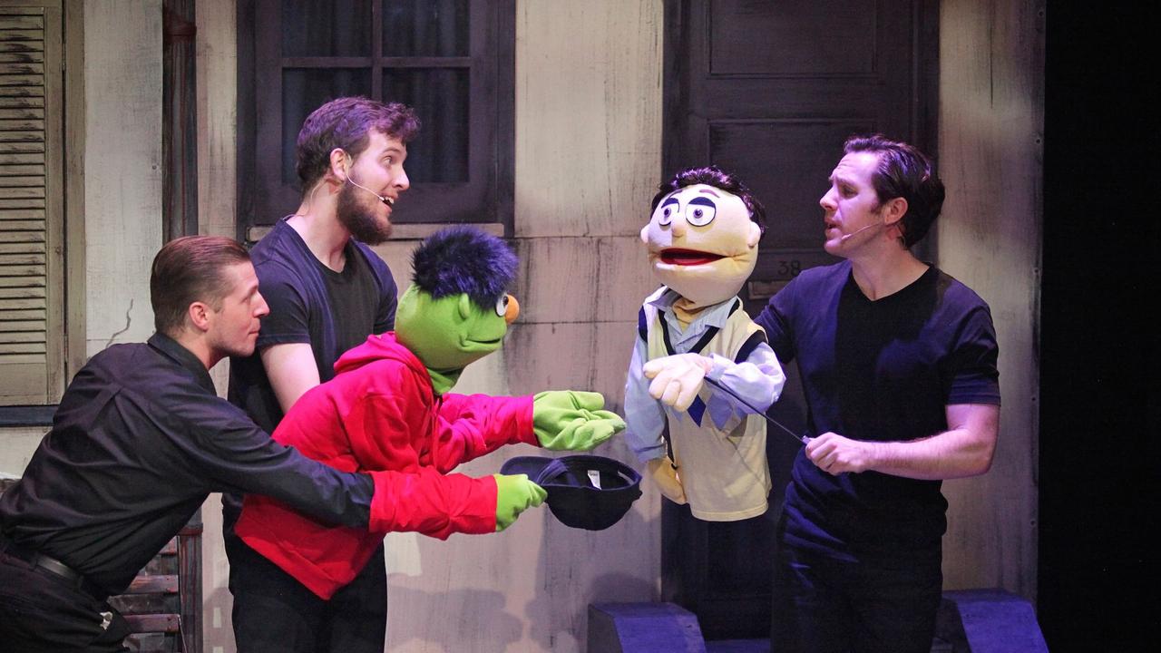 Bringing the puppets of Avenue Q to life are (from left) Mitch Humphrys, Ryan Paroz and Justin Tamblyn.