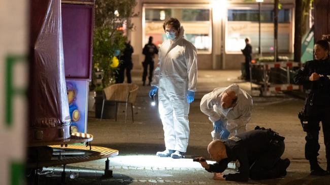 A forensics team investigates a crime scene after the Solingen City festival. Picture: Getty Images.