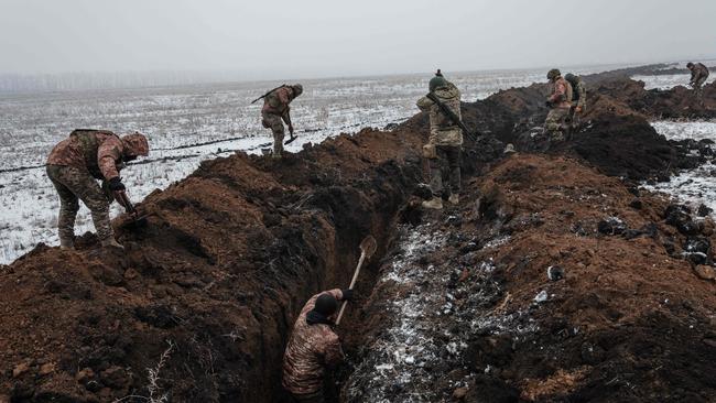 Ukrainian servicemen make a trench near Bakhmut. Picture: AFP.