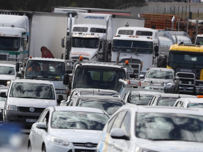 Traffic chaos on the Western Ring road after a person was killed by a passing crane. Tuesday, September 18. 2018. Picture: David Crosling