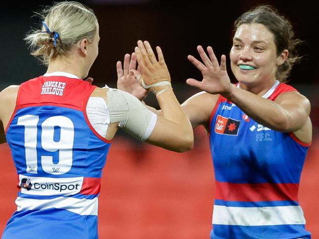 GOLD COAST, AUSTRALIA - AUG 17: Heidi Woodley of the Western Bulldogs celebrates a goal during the 2024 AFLW Practice Match between the Gold Coast SUNS and the Western Bulldogs at People First Stadium on August 17, 2024 in Gold Coast, Australia. (Photo by Russell Freeman/AFL Photos via Getty Images)