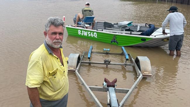 Wayne Featonby, from Banksia Close in Holloways Beach, with his boat.