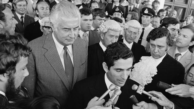 Gough Whitlam listens as Sir John Kerr’s secretary, David Smith, announces the dismissal. Picture: AAP