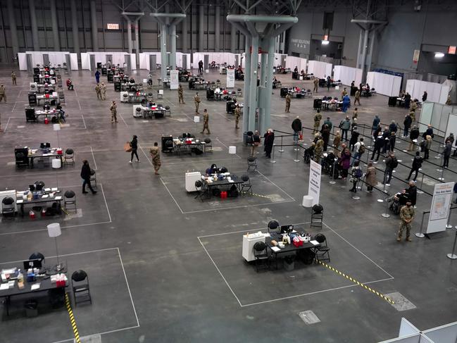 People wait in line during the state-run COVID-19 vaccination media tour at the Jacob K. Javits Convention Center site in New York City. Picture: AFP