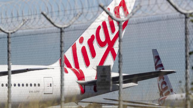 Grounded Virgin Australia planes parked at Brisbane Airport. Picture: Getty Images