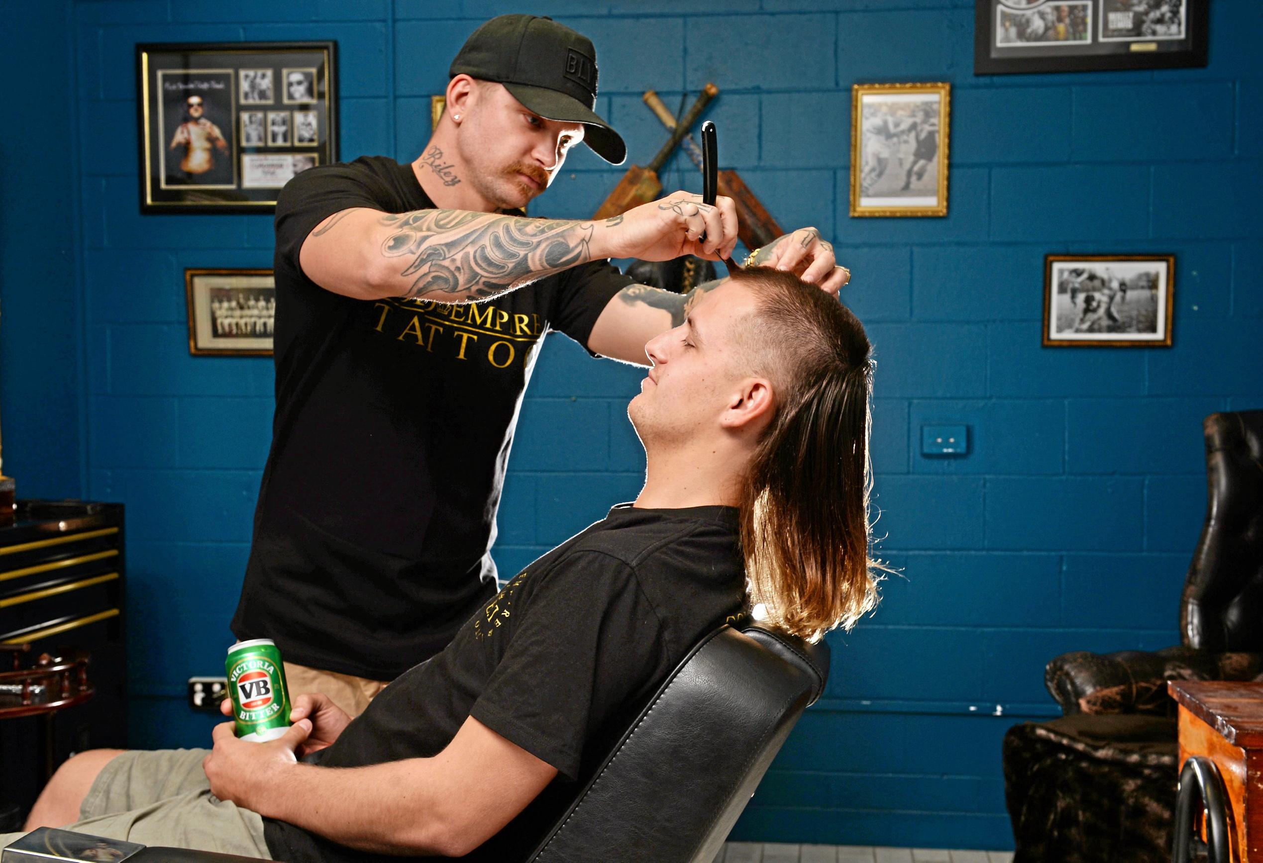 The Mullet is making a comeback in Mackay. Jai Gurr getting his Mullet styled by Andrew Folwell at Gold Empire Tattoo and Hair in Mackay. Picture: Stuart Quinn