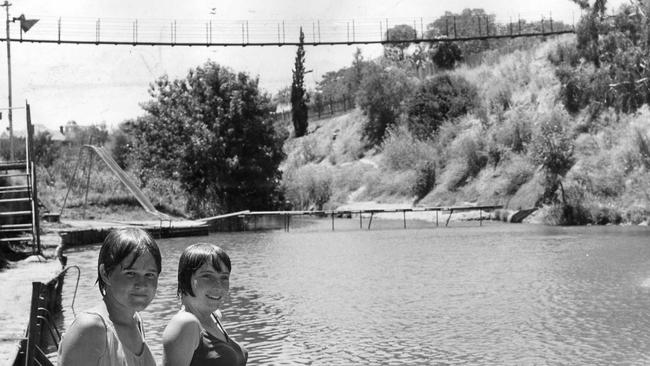 The bridge holds many memories for many people. This picture, taken by Jack Haywurst in 1967, shows young friends at the Gilberton Swimming Pool in 1967, with the suspension bridge n the background.