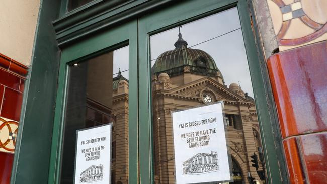 A closed sign on the door of Young and Jackson pub outside Melbourne’s Flinders street station. Picture: NCA NewsWire/ David Crosling