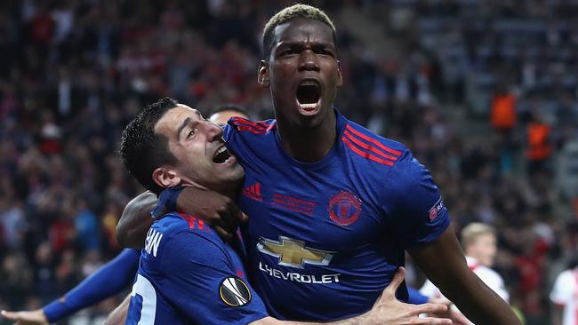 STOCKHOLM, SWEDEN - MAY 24:  Henrikh Mkhitaryan of Manchester United celebrates scoring his sides second goal with Paul Pogba of Manchester United during the UEFA Europa League Final between Ajax and Manchester United at Friends Arena on May 24, 2017 in Stockholm, Sweden.  (Photo by Julian Finney/Getty Images)