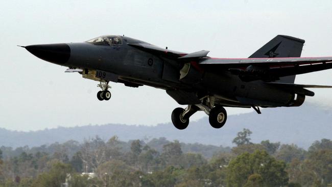 A RAAF F-111 aircraft lands at Amberley air base near Brisbane in 2002. Picture: File