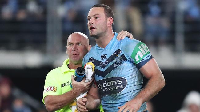 Allan Langer helps Boyd Cordner after a heavy knock during game two. Picture: Brett Costello