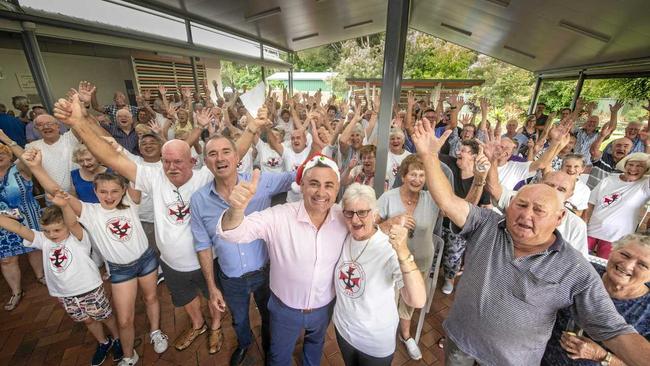 The Iluka community who gathered at the Iluka Bowling Club celebrate the announcement with deputy premier John Barilaro they will get an ambulance station. Picture: Adam Hourigan