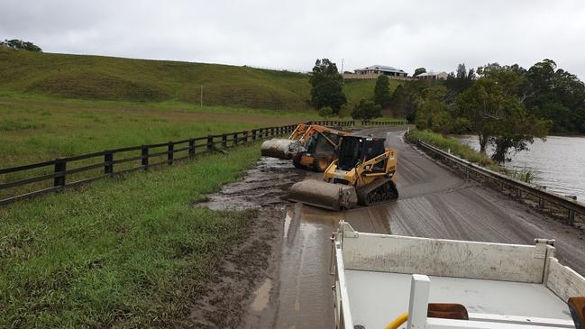 Tweed Shire Council workers have been working to clean up Dulguigan Rd in North Tumbulgum after floodwaters receded.