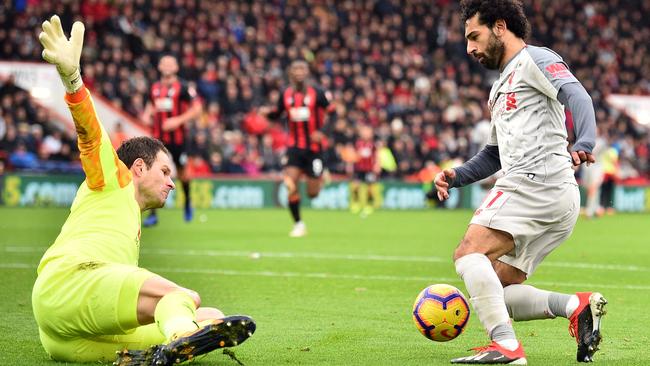 Liverpool’s Mohamed Salah takes the ball around Bournemouth goalkeeper Asmir Begovic to score his third goal in Liverpool’s 4-0 win. Picture: AFP