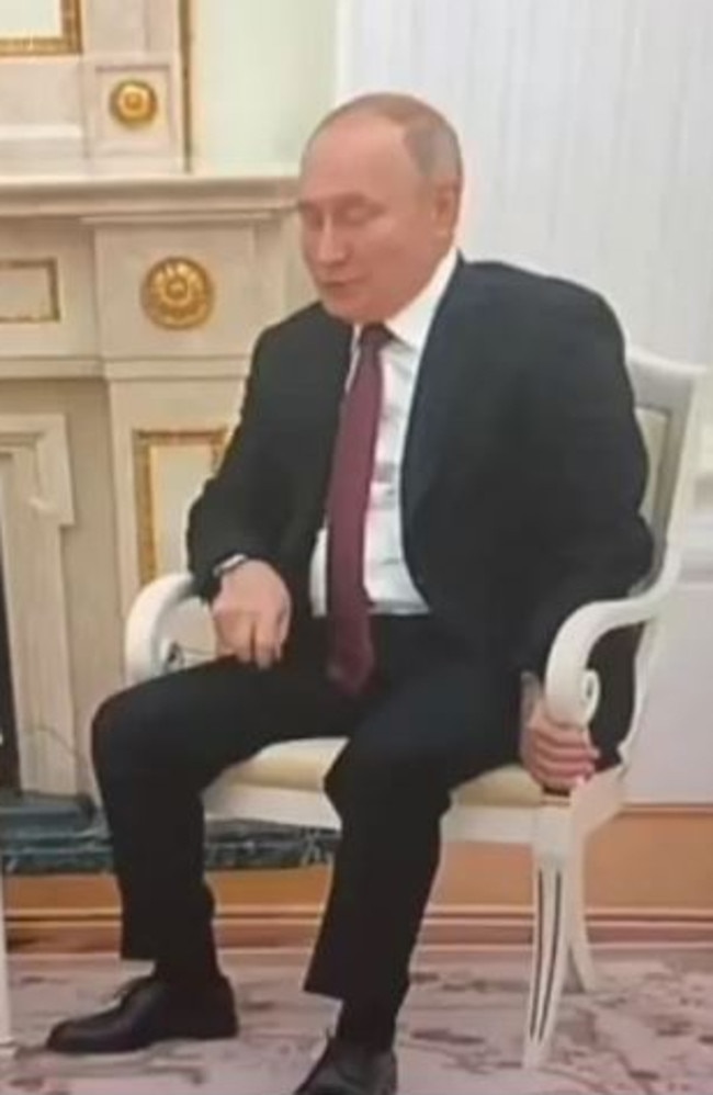 Vladimir Putin's hand appeared purple as he gripped his chair and fidgeted at a meeting earlier this week. Picture: Supplied