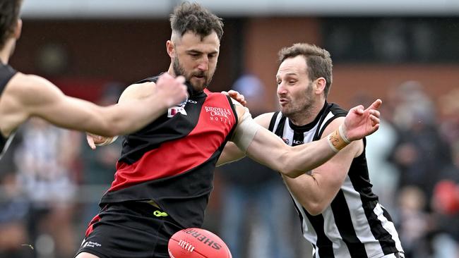 Riddell’s Dylan Tarczon gets a kick against Wallan. Picture: Andy Brownbill