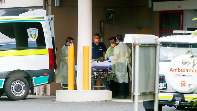 Health workers transfer a patient from the North West Regional Hospital in Burnie to the Mersey Community Hospital in Latrobe. Picture: Patrick Gee.