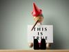 Pinocchio holding sheet of paper. ISTOCK