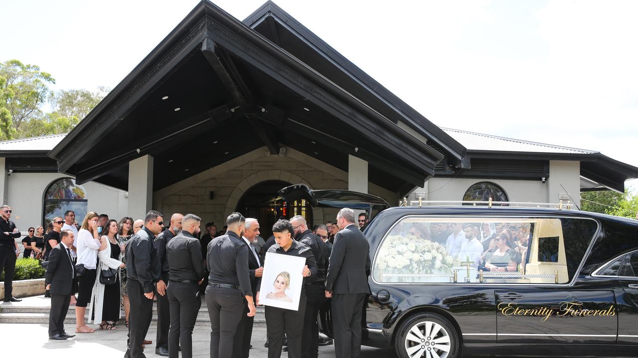 A framed pictured of Vanessa Tadros is carried into the church. Picture NCA Newswire / Gaye Gerard