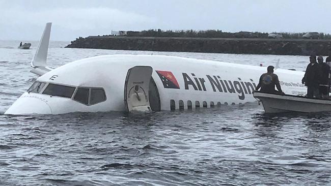 An Air Niugini aircraft ditched into a lagoon after overshooting the runway on the remote island of Weno. Picture: AFP