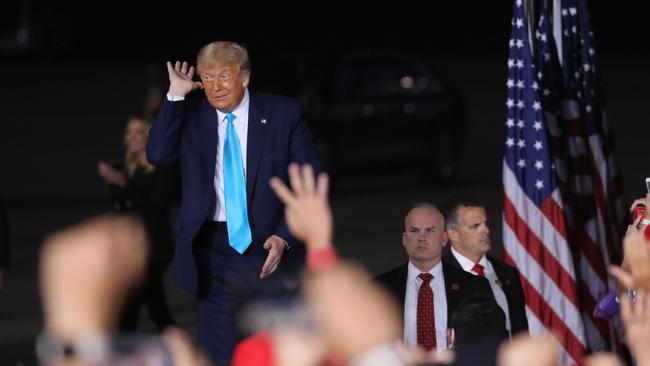 President Donald Trump gestures to loud fans as he speaks at a rally at Harrisburg International Airport on September 26 in Pennsylvania. Picture: Spencer Platt/Getty Images/AFP