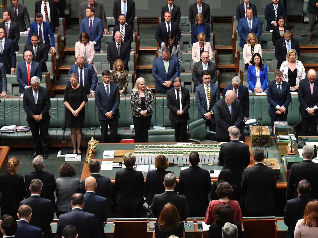 Domestic violence campaigner Angela Lynch urges politicians (above in a minute’s silence for the Clarke family) to ‘take action now’. Picture: Mick Tsikas.