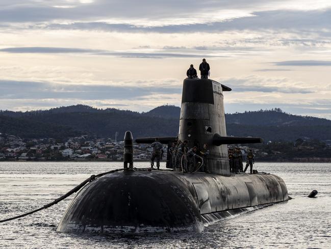 HOBART, AUSTRALIA - APRIL 01: In this handout image provided by the Australian Defence Force, Royal Australian Navy submarine HMAS Sheean arrives for a logistics port visit on April 1, 2021 in Hobart, Australia. Australia, the United States and the United Kingdom have announced a new strategic defence partnership - known as AUKUS - to build a class of nuclear-propelled submarines and work together in the Indo-Pacific region. The new submarines will replace the Royal Australian Navy's existing Collins submarine fleet. (Photo by LSIS Leo Baumgartner/Australian Defence Force via Getty Images)