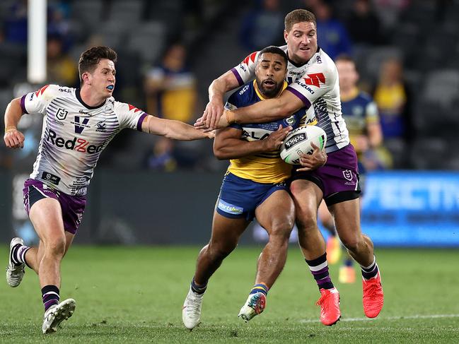 Parramatta's Michael Jennings tackled by Melbourne's Brenko Lee during the NRL match between the Parramatta Eels and Melbourne Storm at Bankwest Stadium. Picture. Phil Hillyard