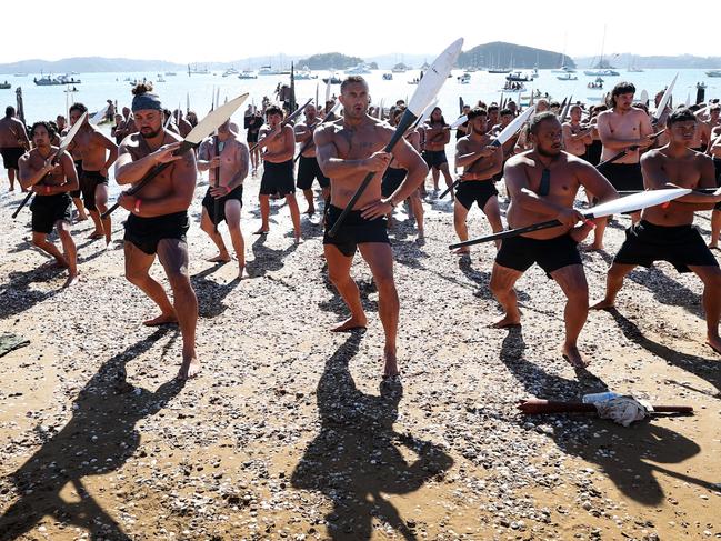 WAITANGI, NEW ZEALAND - FEBRUARY 06: Maori Warriors perform a haka after arriving on beach via waka to commemorate Waitangi Day on on February 06, 2024 in Waitangi, New Zealand. The Waitangi Day national holiday celebrates the signing of the treaty of Waitangi on February 6, 1840 by Maori chiefs and the British Crown, that granted the Maori people the rights of British Citizens and ownership of their lands and other properties. (Photo by Fiona Goodall/Getty Images)