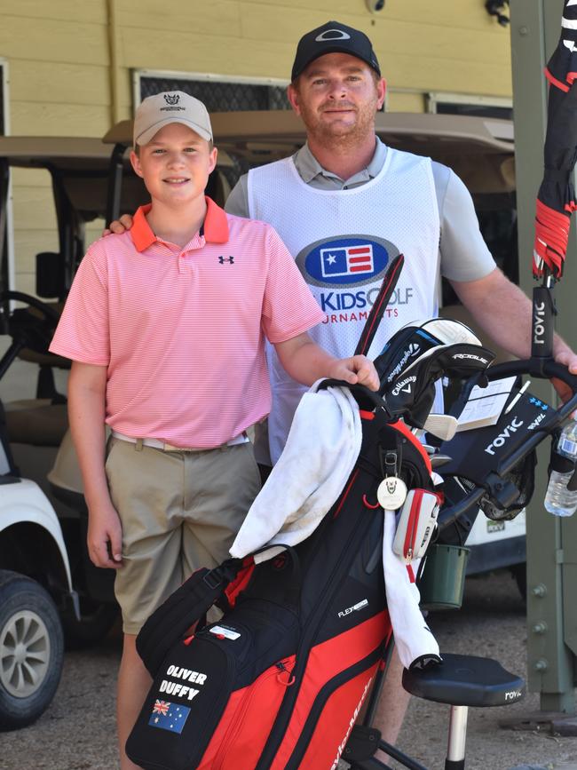 Brisbane's Oliver Duffy (boys 12 years) with dad Shaun at the US Kids Golf Foundation Australian Open at the Rockhampton Golf Club on September 27.