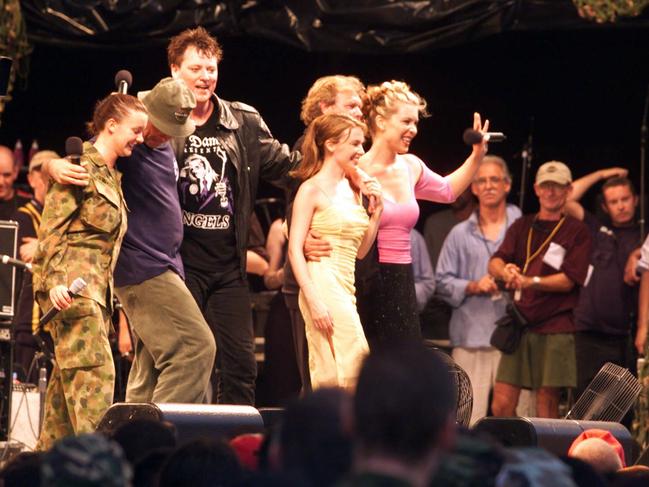 Kylie Minogue (C), Doc Neeson (far L), John Farnham and Gina Jeffreys on stage during Tour of Duty Christmas Concert in Dili, East Timor, 12 December, 1999. Picture: Supplied