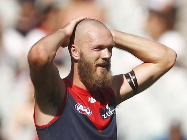 Max Gawn of the Demons and Scott Lycett of the Power exchange words during the Round 1 AFL match between the Melbourne Demons and the Port Adelaide Power at the MCG in Melbourne, Saturday, March 23, 2019. (AAP Image/Daniel Pockett) NO ARCHIVING, EDITORIAL USE ONLY