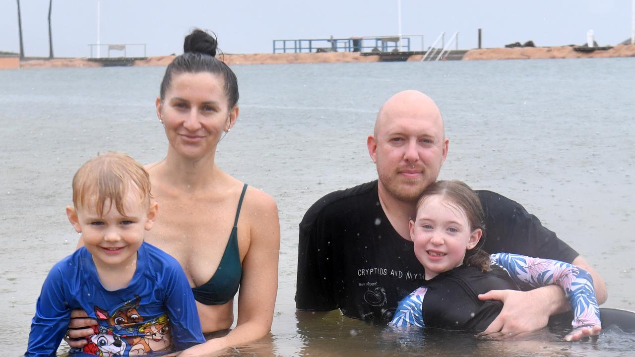 Wet weather in Townsville. The rain does not deter Sahlua Gearor and Ian Wilson with Orson Ryan, 5, and Willow Ryan, 6, from a dip at the rock pool. Picture: Evan Morgan