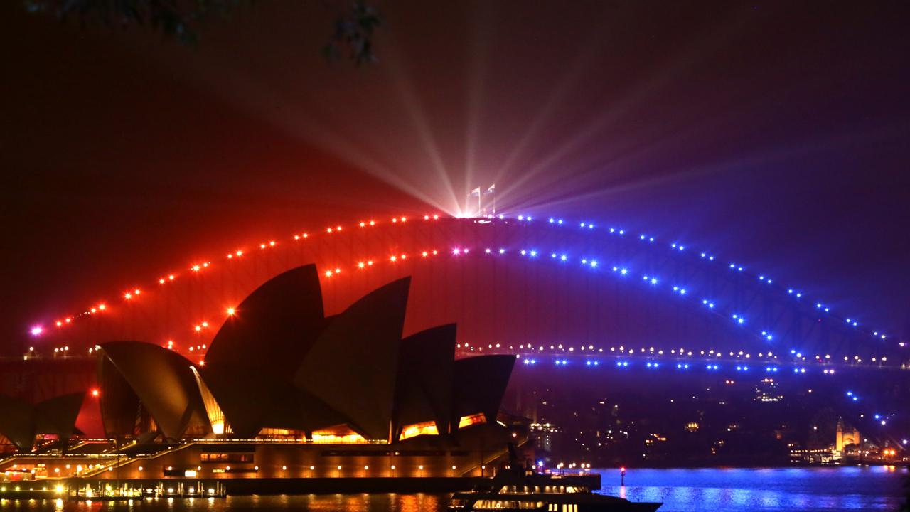 Technicians test lighting on the Sydney Harbour Bridge just before the harbour is illuminated with fireworks and lighting to see in the new year. Pics Bill Hearne