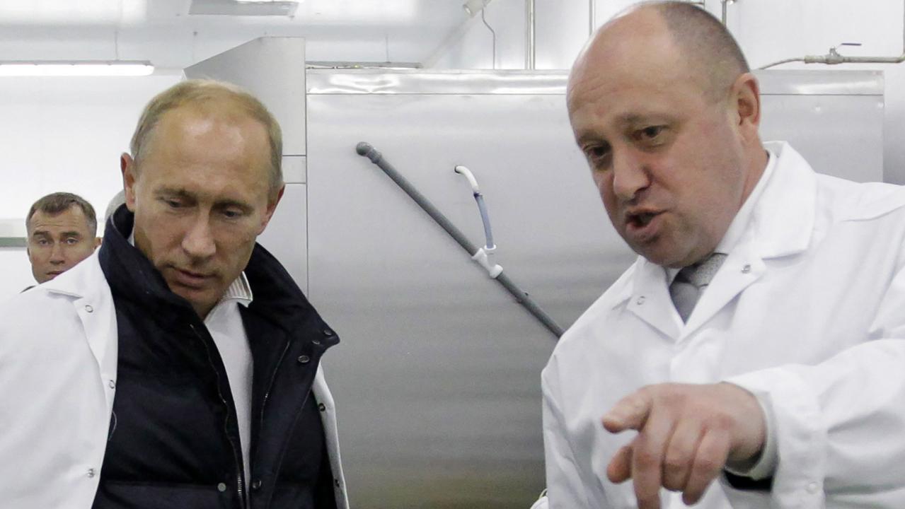 Yevgeny Prigozhin shows Vladimir Putin his school lunch factory outside Saint Petersburg on September 20, 2010. Picture: AFP