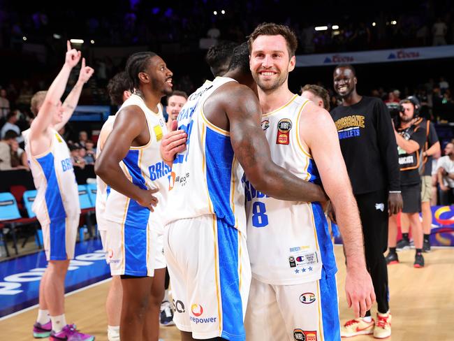 An injury-ravaged Brisbane Bullets side celebrate after beating the 36ers. Picture: Getty Images