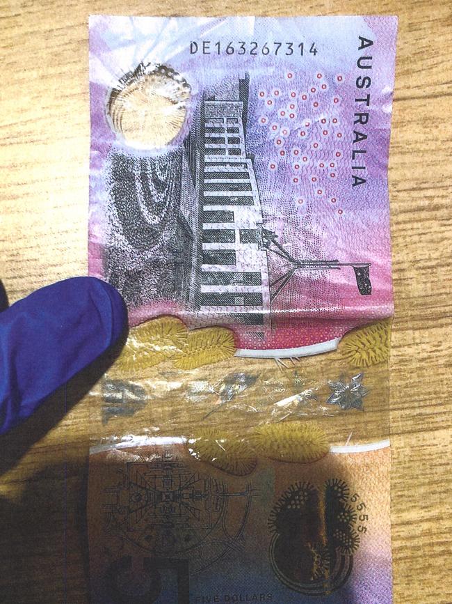 The serial number on top of this $5 note was used as ‘token’ to prove the cash was handed over.