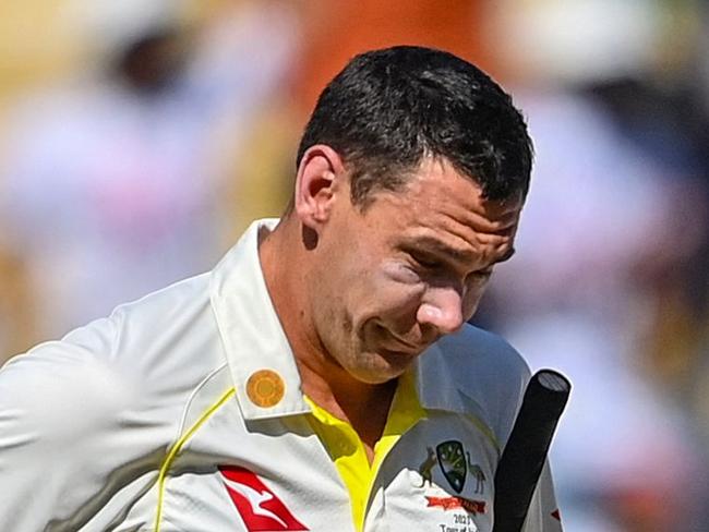 Australia's Scott Boland (L) and teammate Steven Smith walks off the ground after India's win in the first Test cricket match between India and Australia at the Vidarbha Cricket Association (VCA) Stadium in Nagpur on February 11, 2023. (Photo by Indranil MUKHERJEE / AFP) / IMAGE RESTRICTED TO EDITORIAL USE - STRICTLY NO COMMERCIAL USE