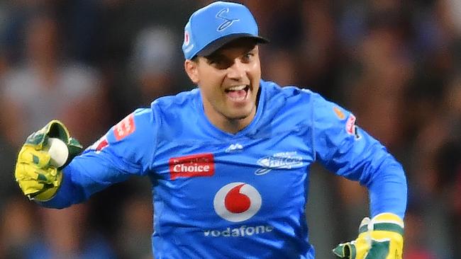 ADELAIDE, AUSTRALIA - JANUARY 21: Alex Carey of the Strikers celebrates after catching the wicket of  Joe Burns of the Heat during the Big Bash League match between the Adelaide Strikers and the Brisbane Heat at Adelaide Oval, on January 21, 2021, in Adelaide, Australia. (Photo by Mark Brake/Getty Images)