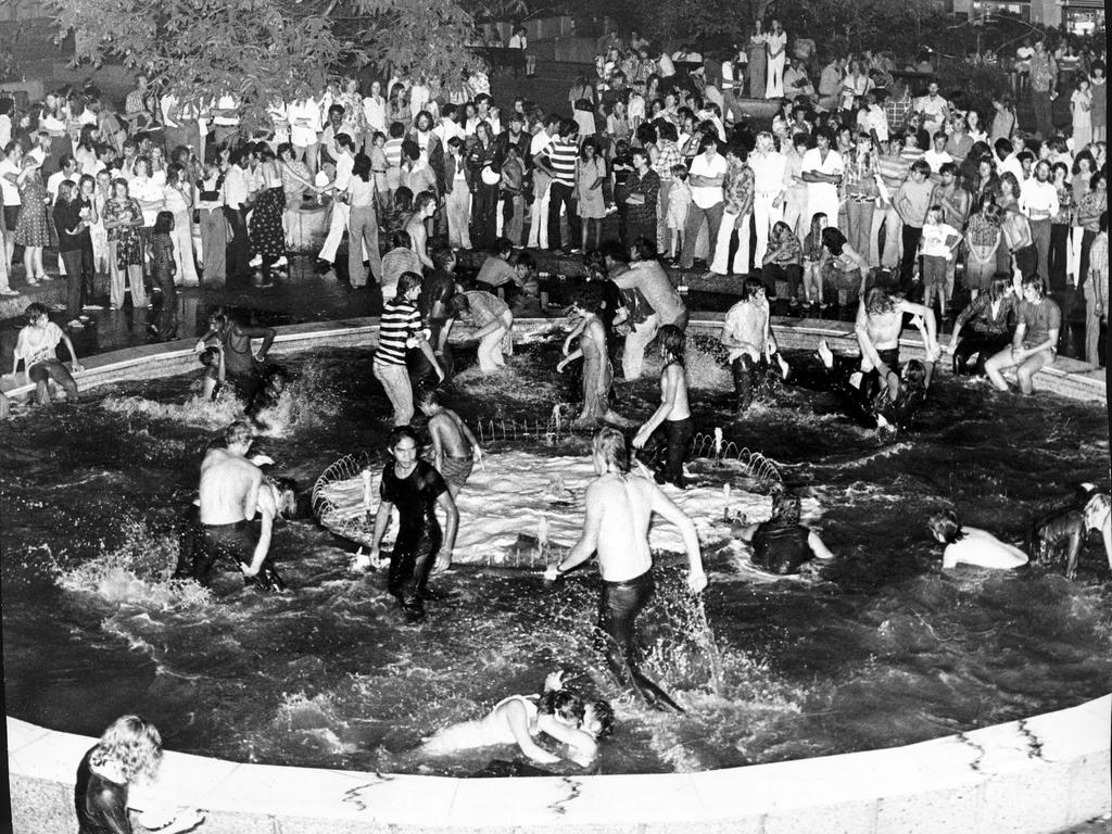 1975 - The fountain in King George Square lured many of the thousands who crowded there for a New Year’s Eve concert. Picture: Barry Pascoe